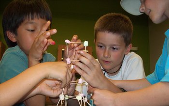 Children building a structure at a science center